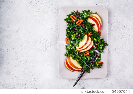 Healthy vegan salad with apple, cranberry, kale 54907044