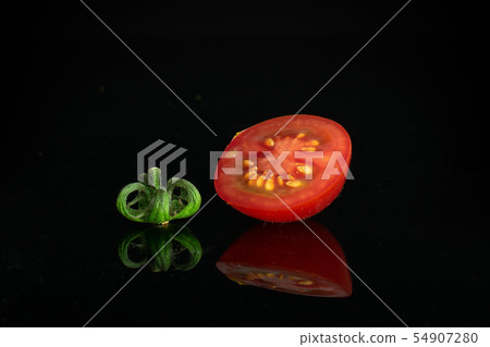 Red cherry tomato isolated on black glass Red cherry tomato isolated on black glass 54907280