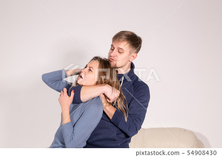 People, abuse and violence concept - aggressive man strangling his wife People, abuse and violence concept - aggressive man strangling his wife 54908430