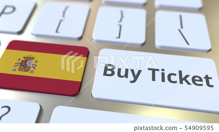 BUY TICKET text and flag of Spain on the buttons on the computer keyboard. Travel related conceptual 54909595