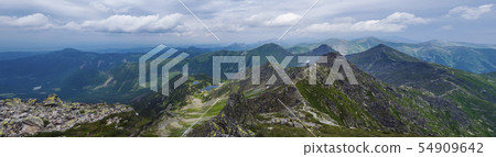 Panoramic view from Rohac peak on Western Tatra mountains or Rohace panorama with hiking trail on Panoramic view from Rohac peak on Western Tatra mountains or Rohace panorama with hiking trail on 54909642