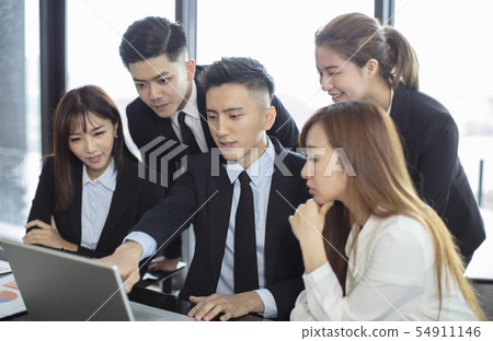 business people looking at the laptop computer business people looking at the laptop computer 54911146