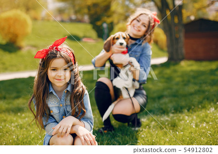 Cute and stylish family in a spring park 54912802