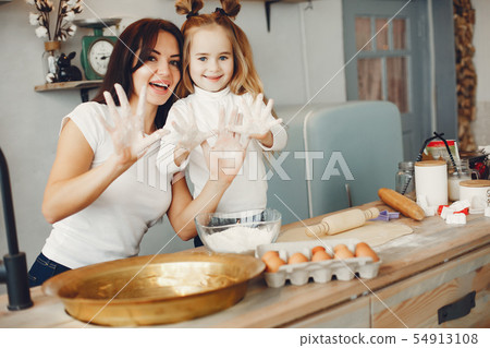 Family cook the dough for cookies 54913108