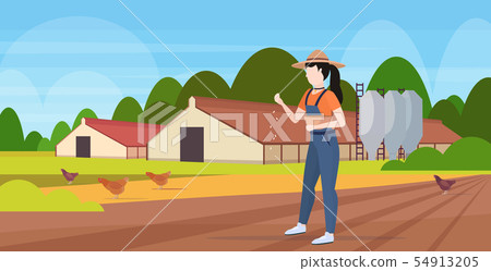 woman farmer feeding chicken free range poultry breeding farming agriculture concept barn building 54913205