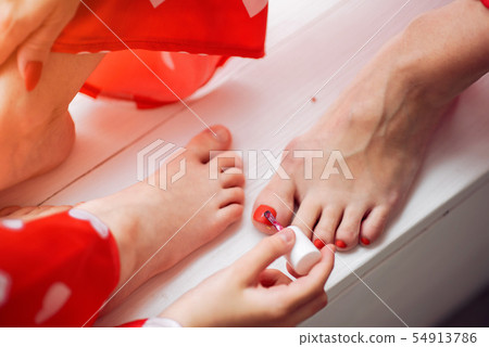 Cute mother and daughter at home in a pajamas 54913786