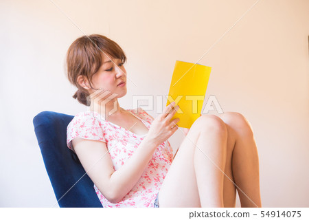Young woman lifestyle reading relax leisurely 54914075