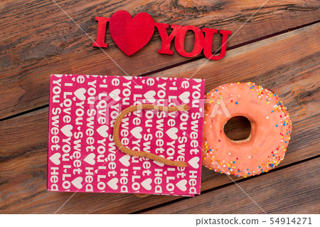 Frosted donut and I love you inscription. 54914271