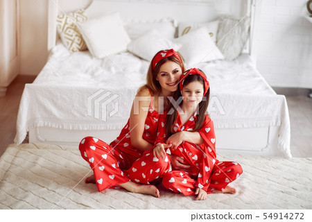 Cute mother and daughter at home in a pajamas 54914272