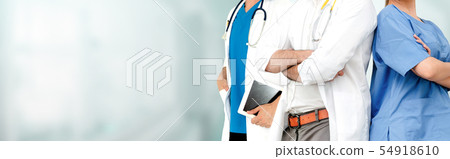 Doctor working in hospital with other doctors. Doctor working in hospital with other doctors. 54918610