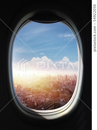 City scenery with a child's eyes on a window in an airplane 54922056