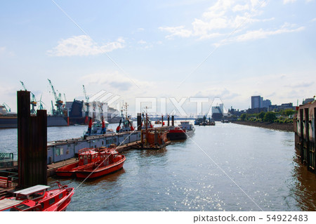 boats are parked near the port 54922483