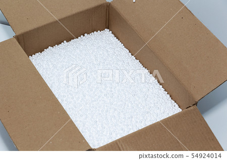 Round foam balls in a cardboard box. Environmental 54924014