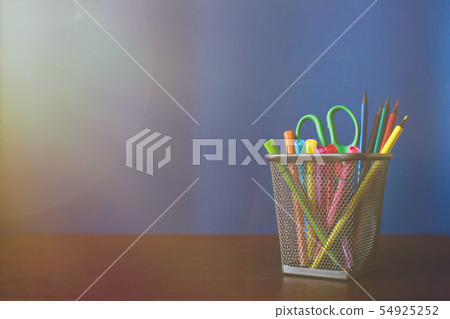 Schoolchild and student studies accessories. Back to school concept. Pencils and felt pens on blue Schoolchild and student studies accessories. Back to school concept. Pencils and felt pens on blue 54925252