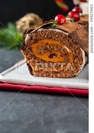 Buche de Noel. Traditional Christmas dessert, Christmas yule log cake with chocolate cream Buche de Noel. Traditional Christmas dessert, Christmas yule log cake with chocolate cream 54925663