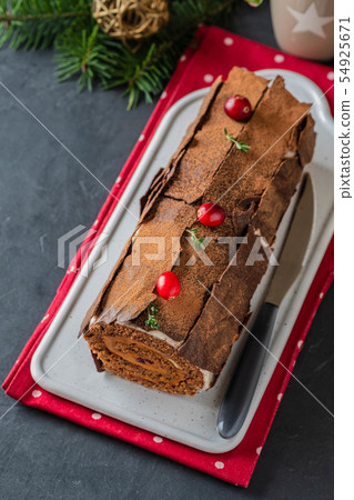 Buche de Noel. Traditional Christmas dessert, Christmas yule log cake with chocolate cream 54925671