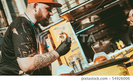 Man enjoing outdoor street food festival, Beer and Burger event 54926006