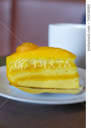 Orange Cake on white dish. 54926660