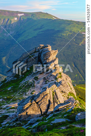 Big boulder on summer mountain slope 54926977