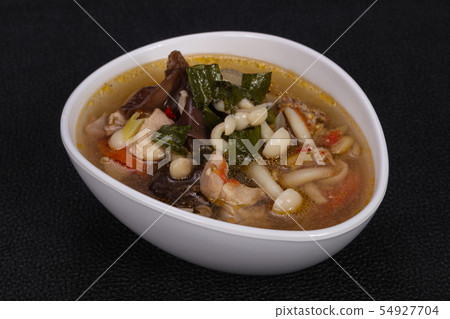 Thai style soup with meat and mushrooms 54927704