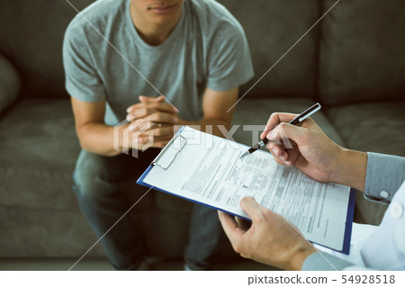 Doctor holding pen is checking the patient 54928518