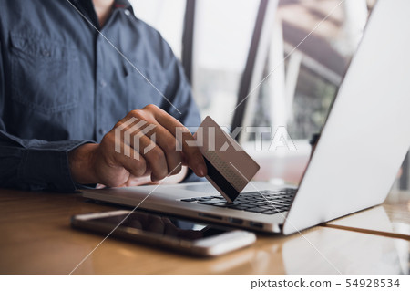 Man using credit card with shopping online concept Man using credit card with shopping online concept 54928534