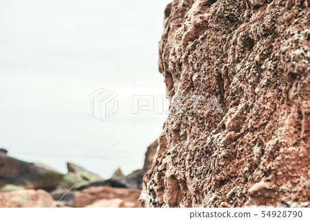 Close up photo of old stone brown wall on the beach 54928790