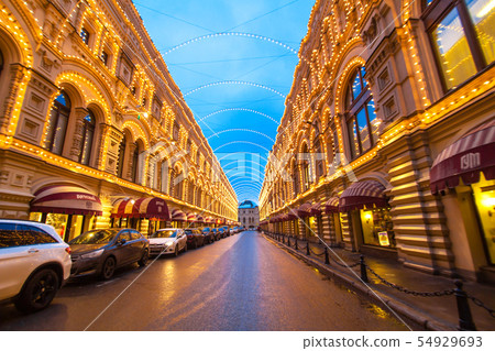 Street with buildings decorated with garlands. Street with buildings decorated with garlands. 54929693