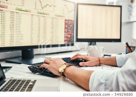 Businessman at work. Cropped photo of male trader's hands with watch on his wrist working on Businessman at work. Cropped photo of male trader's hands with watch on his wrist working on 54929880