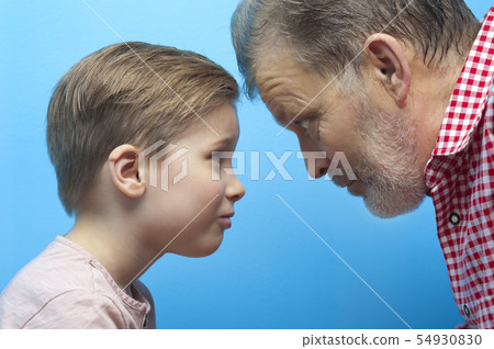 Close-up grandfather and grandson closely look Close-up grandfather and grandson closely look 54930830