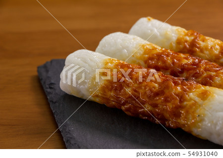 Grilled chicken meat on a slate plate. 54931040