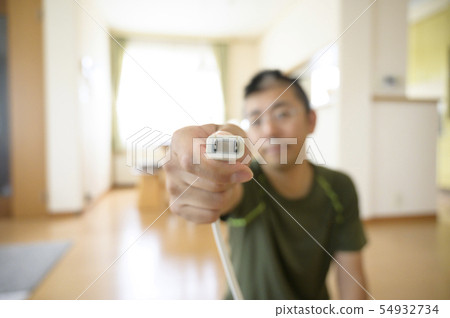 Person plugging in the power plug 54932734