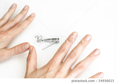 Trimmed nails of a young man. Closeup. Trimmed nails of a young man. Closeup. 54936015