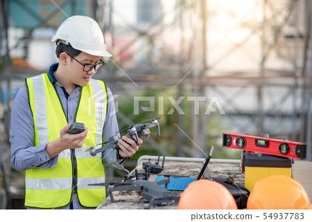 Asian engineer man using drone for site survey Asian engineer man using drone for site survey 54937783