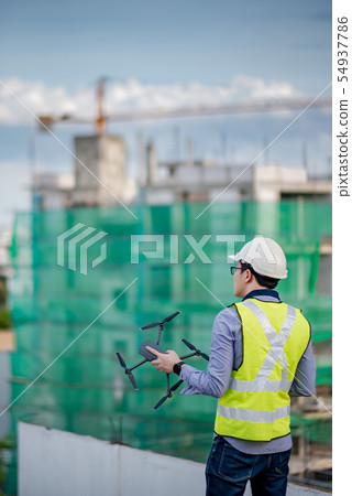 Asian engineer man using drone for site survey Asian engineer man using drone for site survey 54937786
