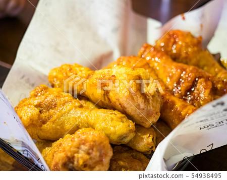 basket of tasty fried chicken tenders basket of tasty fried chicken tenders 54938495