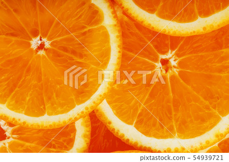 Slices of ripe orange backlit as a textural background. Full screen, close-up, macro 54939721
