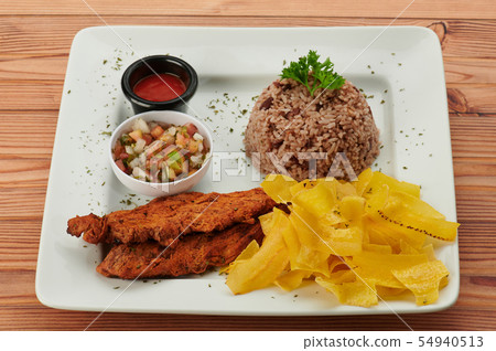 Gallo pinto with salsa and fried meat 54940513