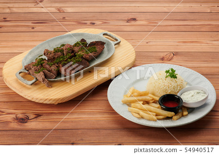 Barbecue steak on wooden table 54940517