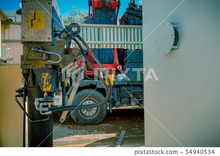 Closeup of hydraulic pistons of a truck 54940534