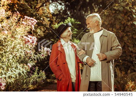Cheerful senior couple talking during their stroll. 54940545