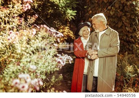 Happy elderly couple taking a stroll together. 54940556