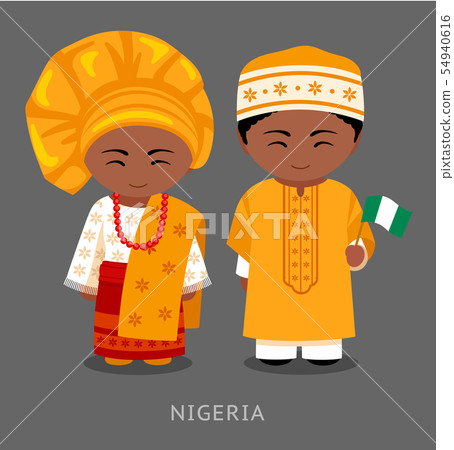 Nigerians in national clothes with a flag. 54940616