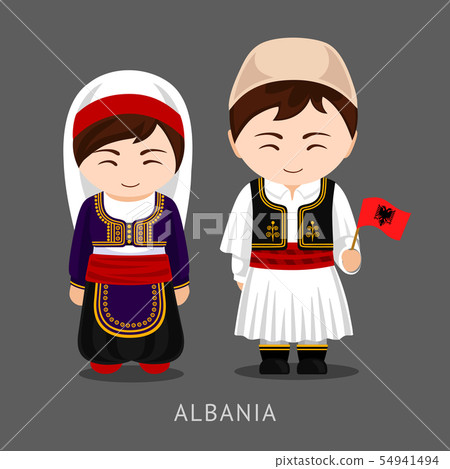 Algerians in national dress with a flag. 54941494