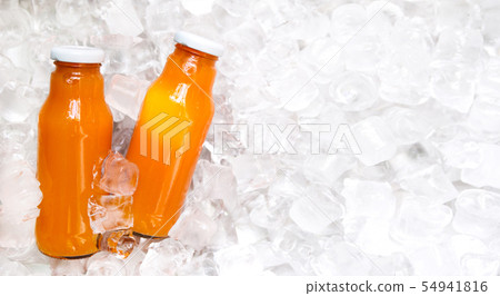 Detox refreshing orange drink in glass bottle on ice 54941816