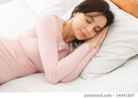 Beautiful young woman sleeping in her bed 54941897