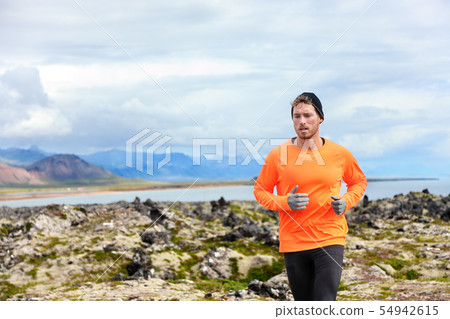 Sport running man in cross country trail run Sport running man in cross country trail run 54942615