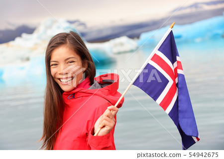 Icelandic flag - girl holding Iceland flag at glacier 54942675