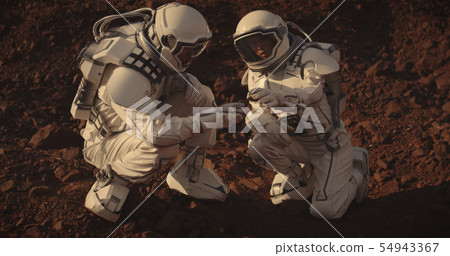 Astronauts collecting rock samples on Mars Astronauts collecting rock samples on Mars 54943367