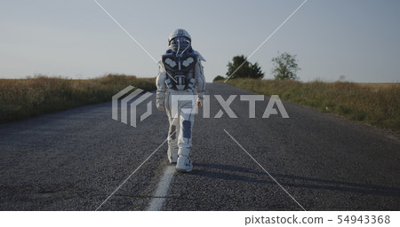Astronaut walking on road Astronaut walking on road 54943368